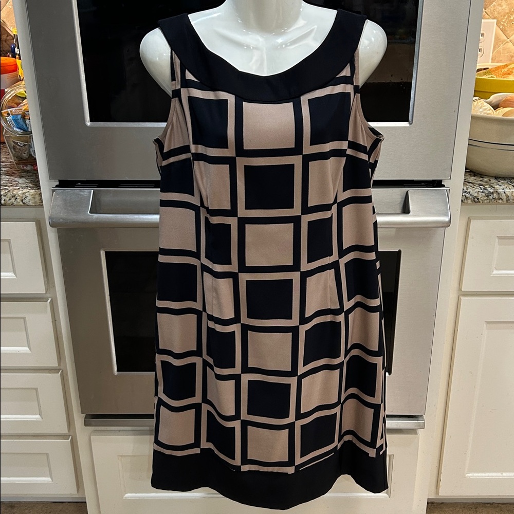 Connected size 16 polyester/spandex black/tan dress.  See photos for details and